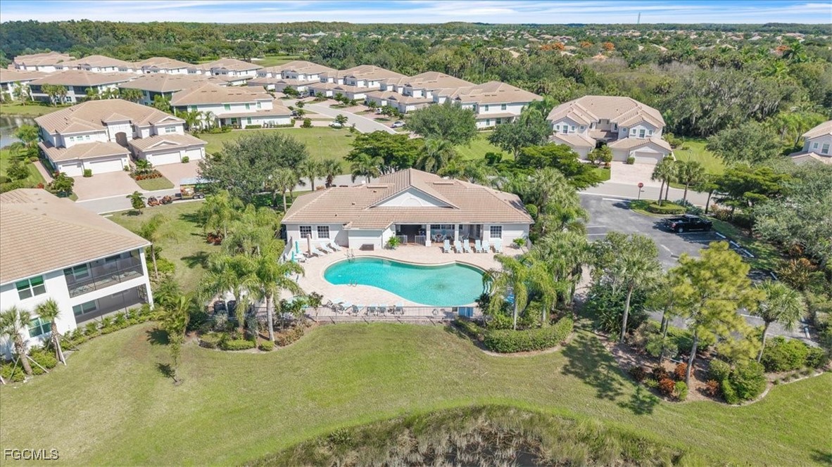 3711 Pebblebrook Ridge Court, Unit 101 Fort Myers, FL 33905 - Photo 41 of 50 an aerial view of a house with a garden and mountain view in back
