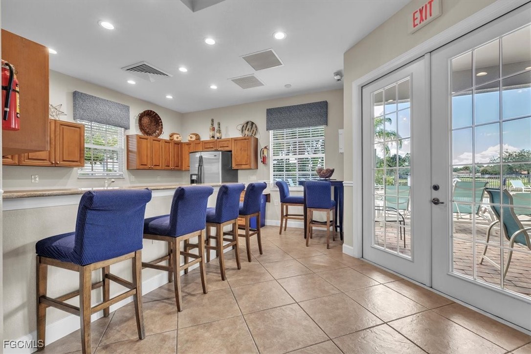 3711 Pebblebrook Ridge Court, Unit 101 Fort Myers, FL 33905 - Photo 43 of 50 a view of a dining room with furniture