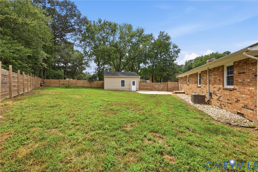 3221 Clintwood Road Midlothian, VA 23112 - Photo 40 of 46 Expansive backyard with a manicured lawn, full per