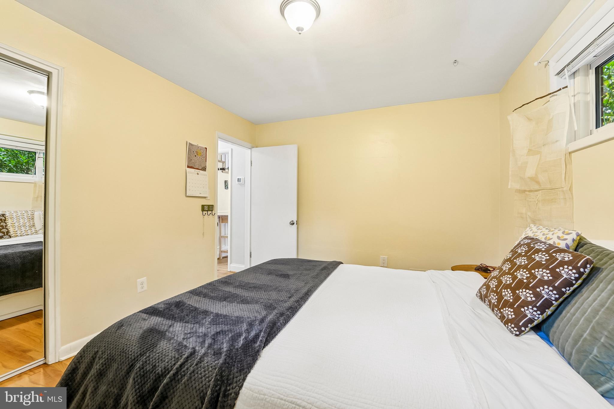 6640 Loch Hill Road Baltimore, MD 21239 - Photo 14 of 35 a bedroom with a bed and a window