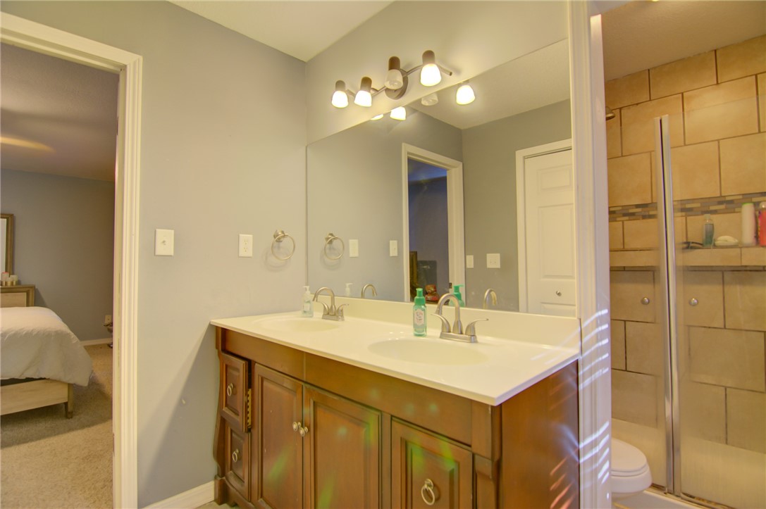 2231 West Packard Street Decatur, IL 62522 - Photo 31 of 39 a bathroom with a sink and a mirror