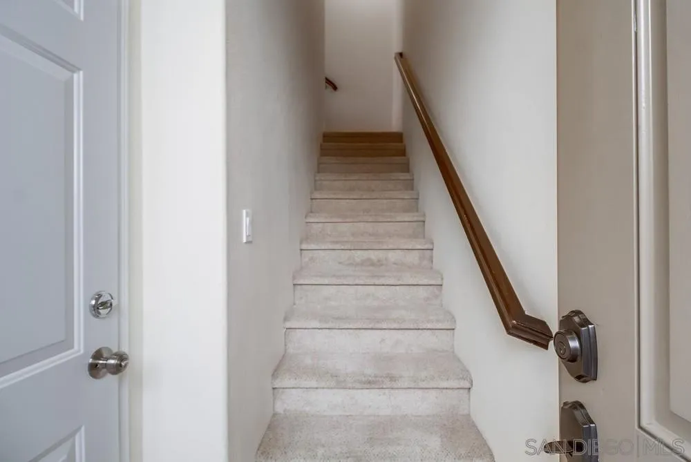1298 Fools Gold Way, Unit 4 Chula Vista, CA 91913 - Photo 5 of 38 a view of staircase with white walls