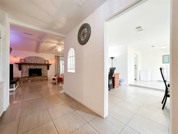 a view of a livingroom with a fireplace and a large window