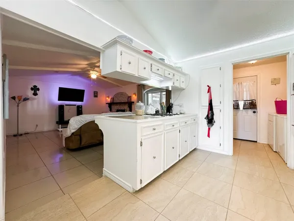 a kitchen with stainless steel appliances kitchen island granite countertop a sink and cabinets