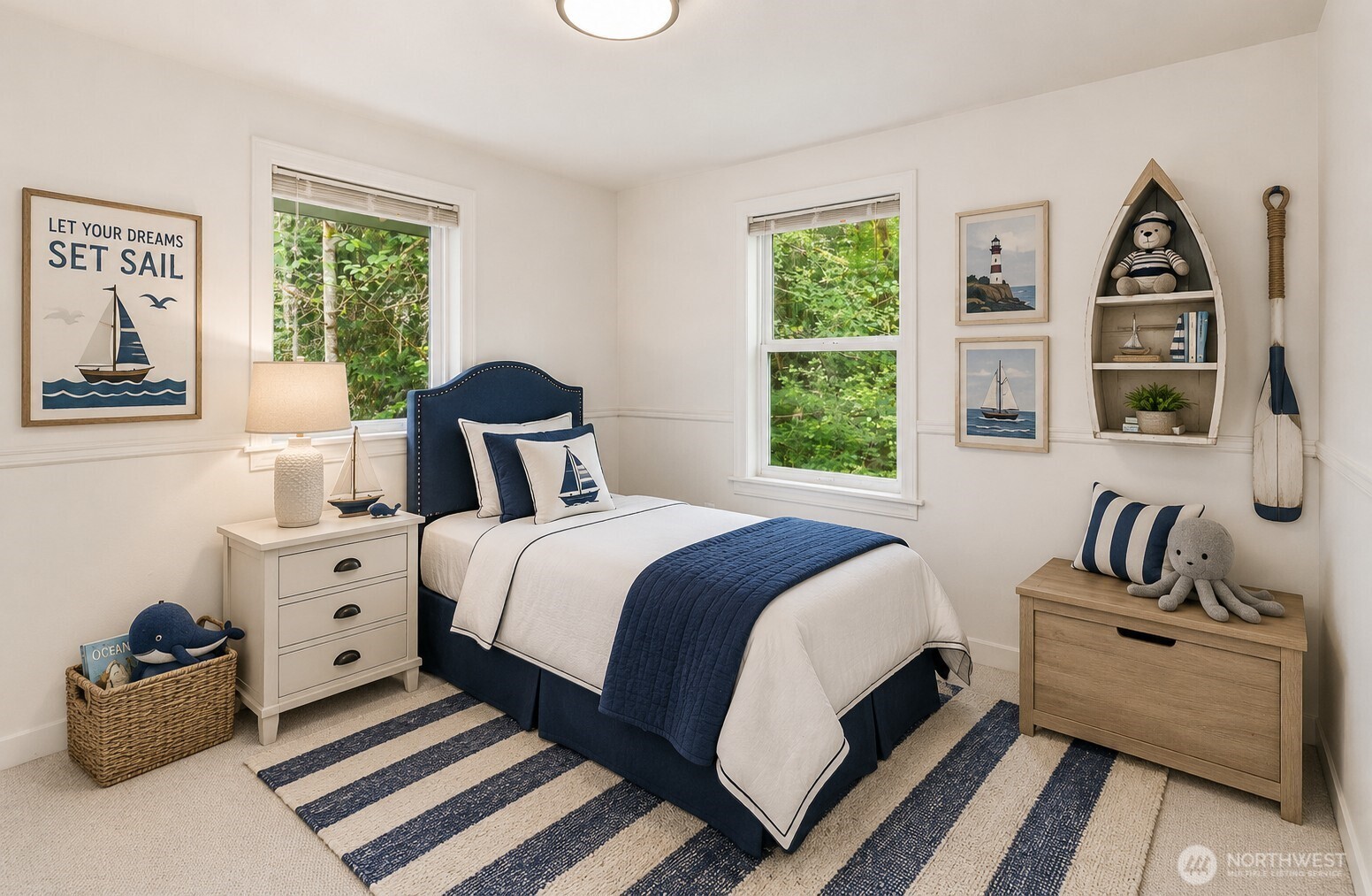 7605 Northeast Hidden Cove Road Bainbridge Island, WA 98110 - Photo 12 of 36 a bedroom with a bed and a large window
