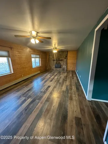 a kitchen with granite countertop a sink cabinets and stainless steel appliances