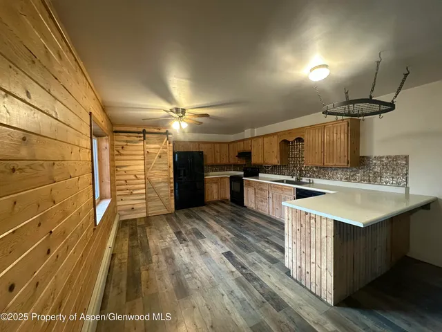 a view of a hallway with a large window