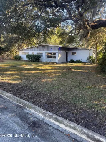 a kitchen with a sink cabinets and stainless steel appliances