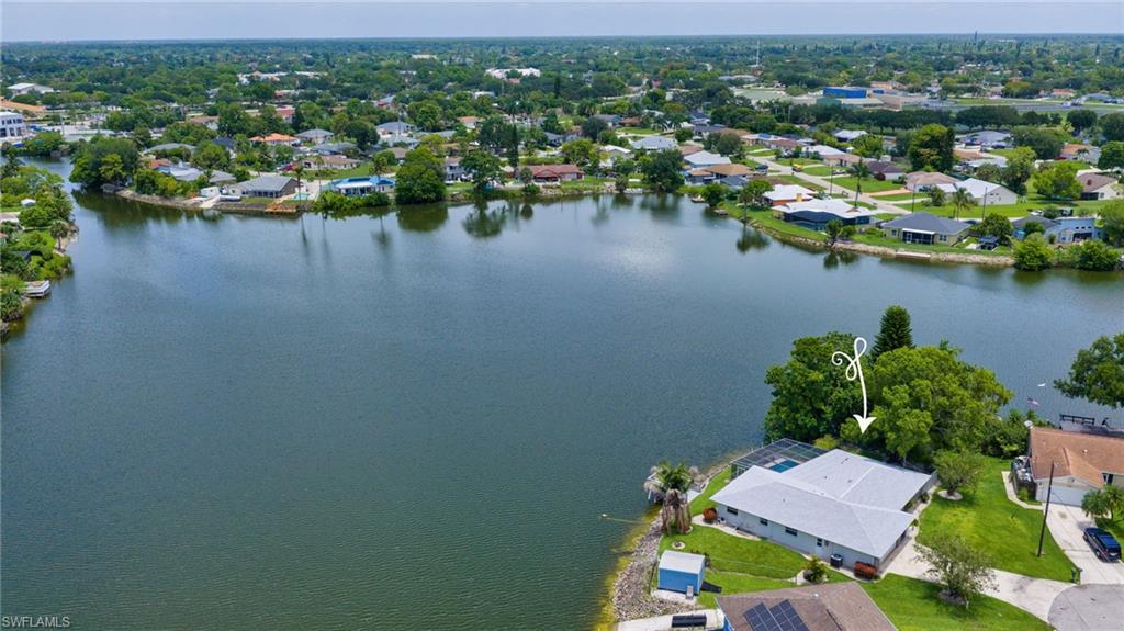 3065 50th Lane Southwest Naples, FL 34116 - Photo 27 of 31 an aerial view of residential houses with outdoor space and lake view