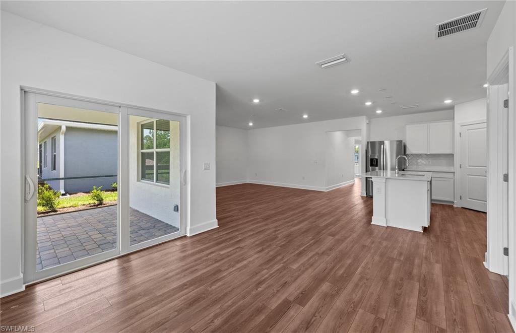 42343 Andes Loop Punta Gorda, FL 33982 - Photo 15 of 43 Sliding glass door onto screened lanai - Interior photos of home - Updated 8/7/24