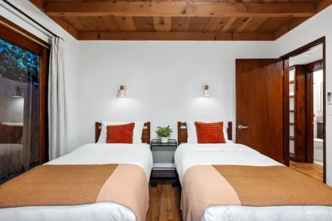 a view of a livingroom with furniture and a potted plant