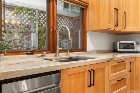 a bathroom with a sink vanity granite and toilet