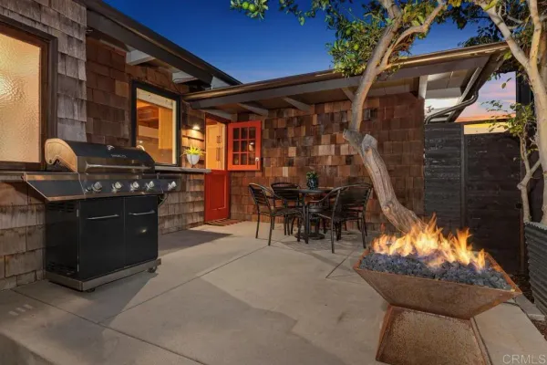 a kitchen with stainless steel appliances kitchen island granite countertop a refrigerator and a sink