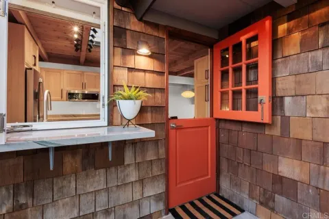 a kitchen with stainless steel appliances kitchen island granite countertop a refrigerator and a sink