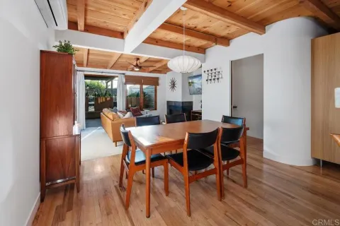 a view of a livingroom with furniture and a flat screen tv
