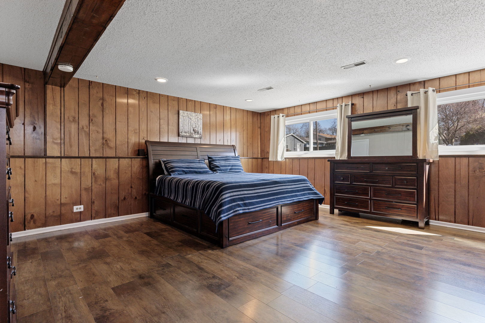 N151 Stanley Street Winfield, IL 60190 - Photo 16 of 27 a bedroom with a bed closet and wooden floor