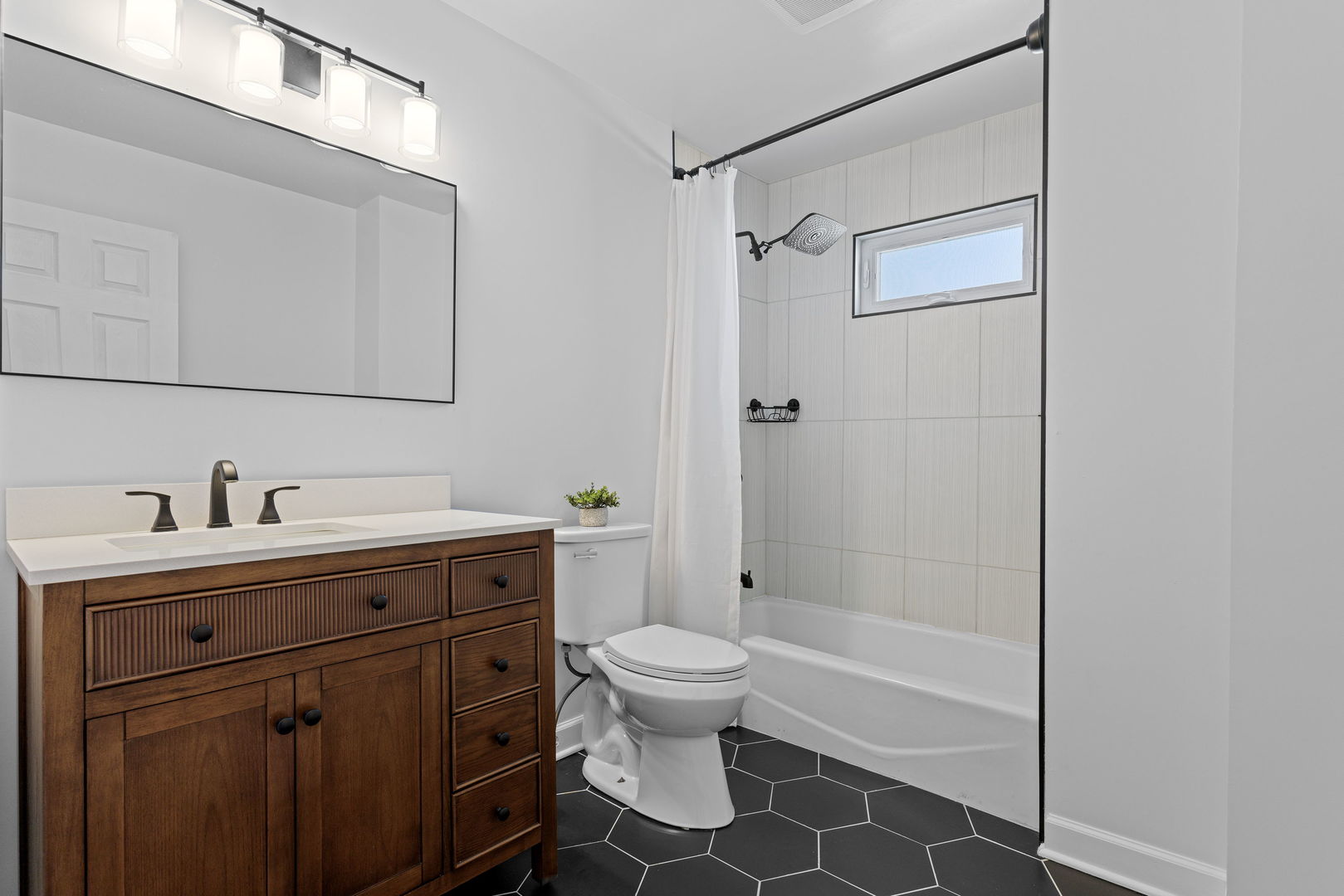 N151 Stanley Street Winfield, IL 60190 - Photo 23 of 27 a bathroom with a sink a toilet and shower