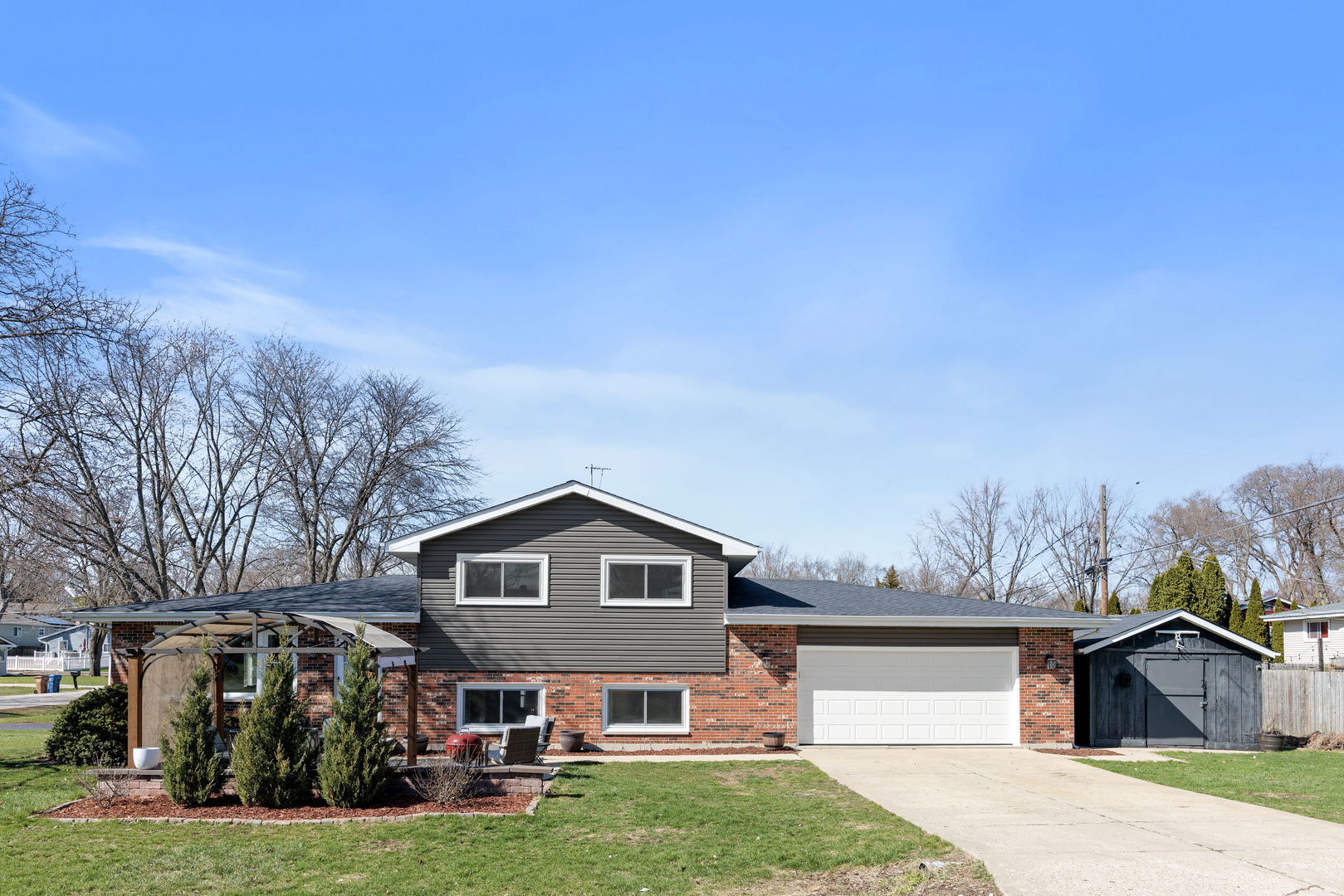 N151 Stanley Street Winfield, IL 60190 - Photo 27 of 27 a front view of a house with a yard and garage