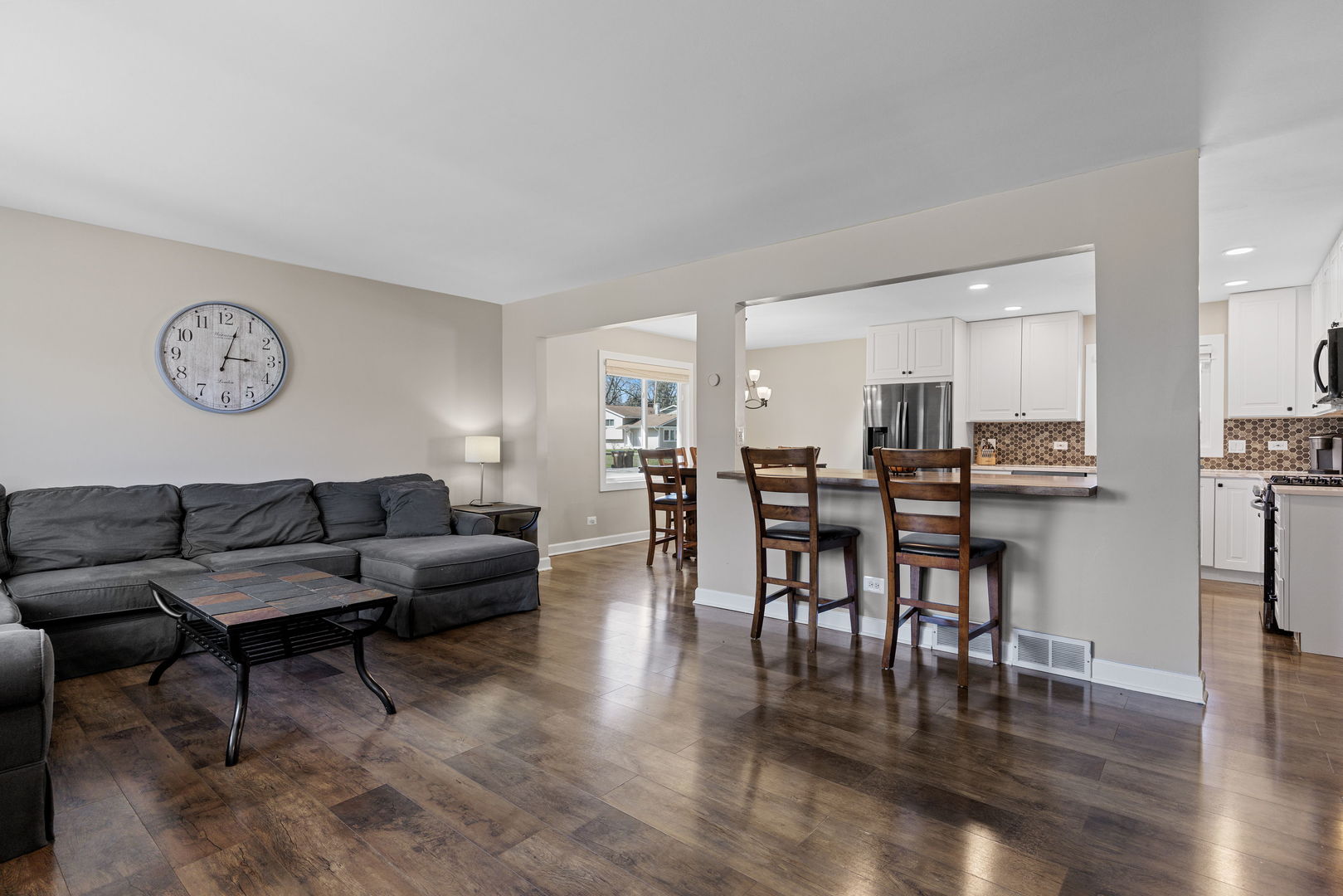 N151 Stanley Street Winfield, IL 60190 - Photo 5 of 27 a living room with furniture kitchen view and a dining table