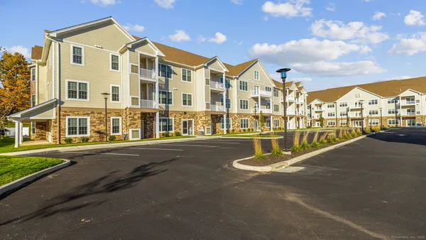 a view of tall building with a street