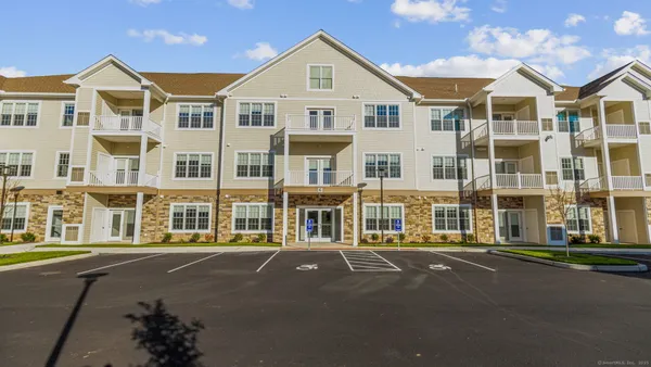 a front view of a building with a street