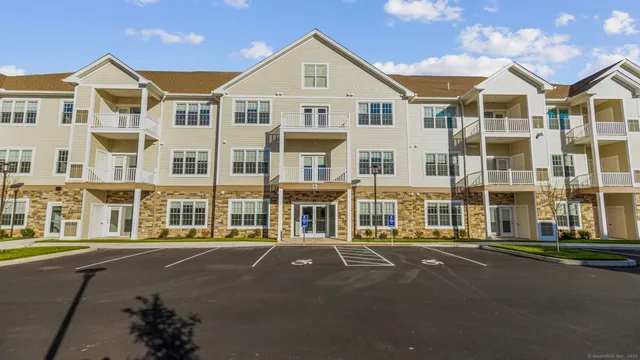 a front view of a building with a street