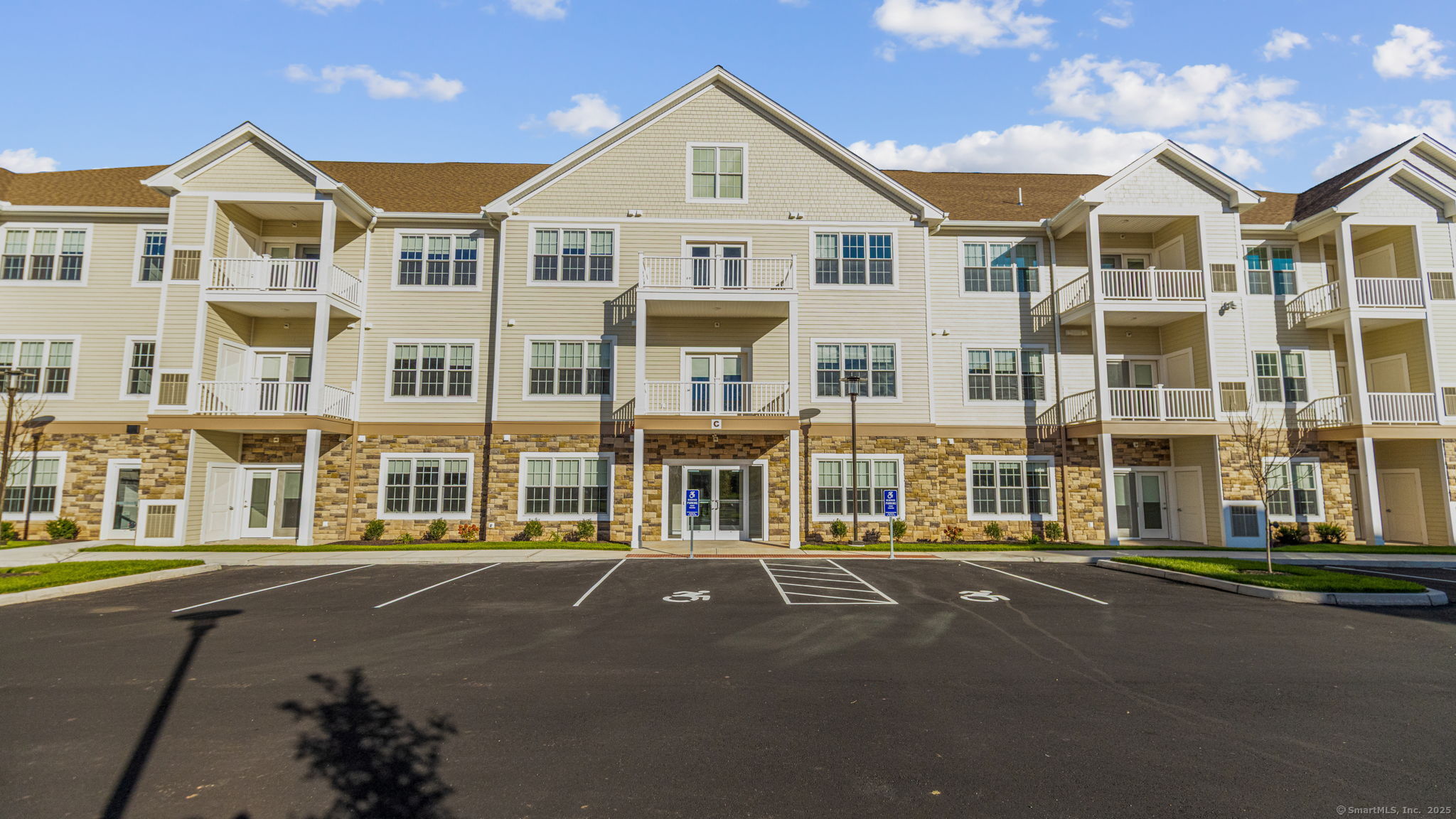 104 Episcopal Road, Unit 2 Berlin, CT 06037 - Photo 3 of 20 a front view of a building with a street