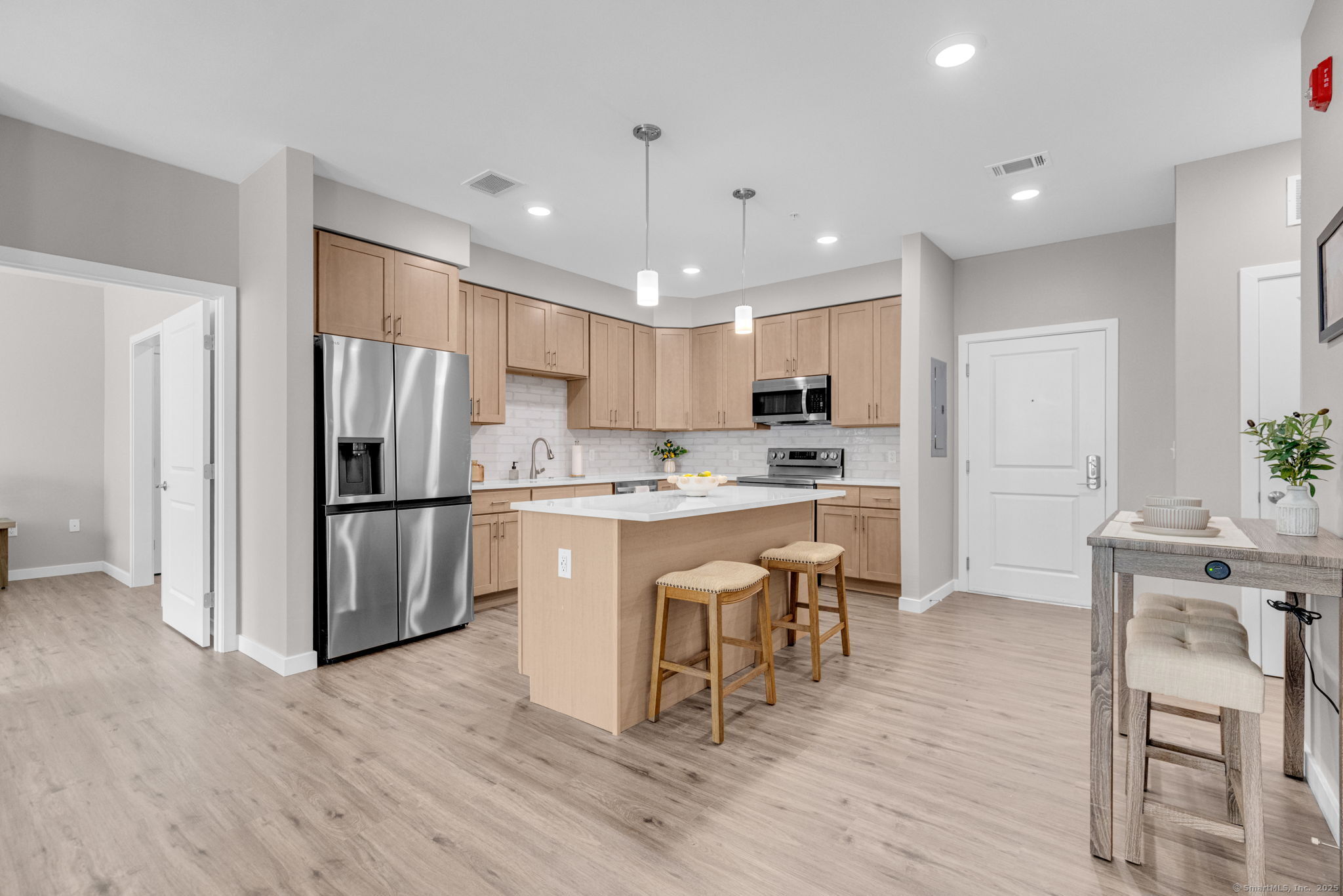 104 Episcopal Road, Unit 2 Berlin, CT 06037 - Photo 8 of 20 a kitchen with a refrigerator a sink and a stove top oven