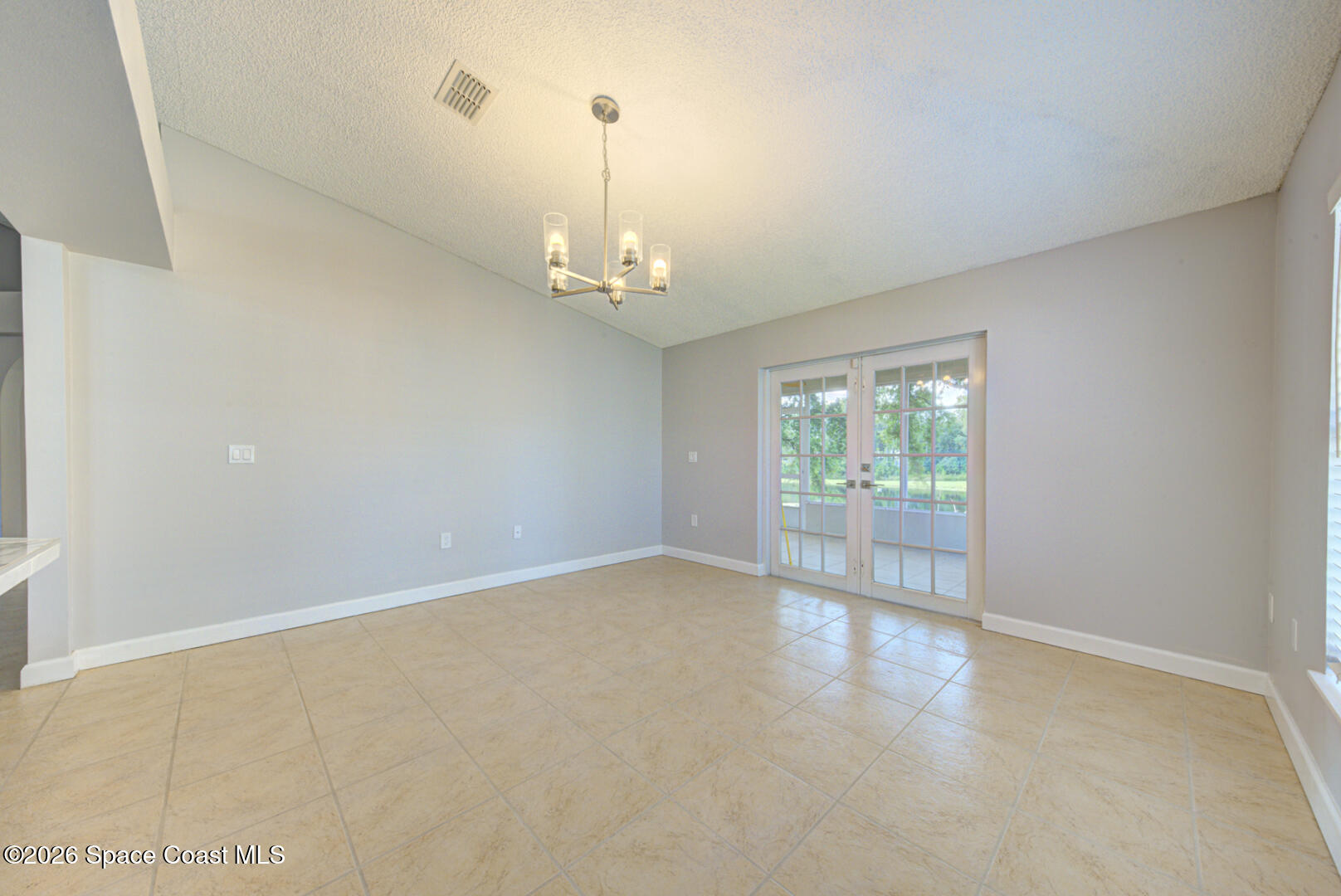 3353 Echo Ridge Place Cocoa, FL 32926 - Photo 21 of 51 dining room with doors to porch