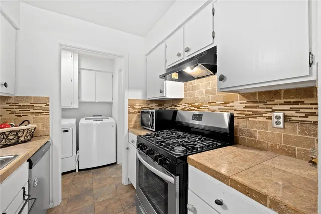a kitchen with a stove and a sink