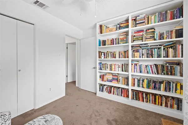 a view of a book shelf with lots of books