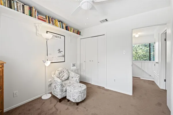 a view of staircase with white walls