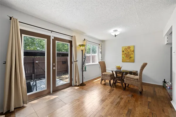 a view of a livingroom with furniture and wooden floor