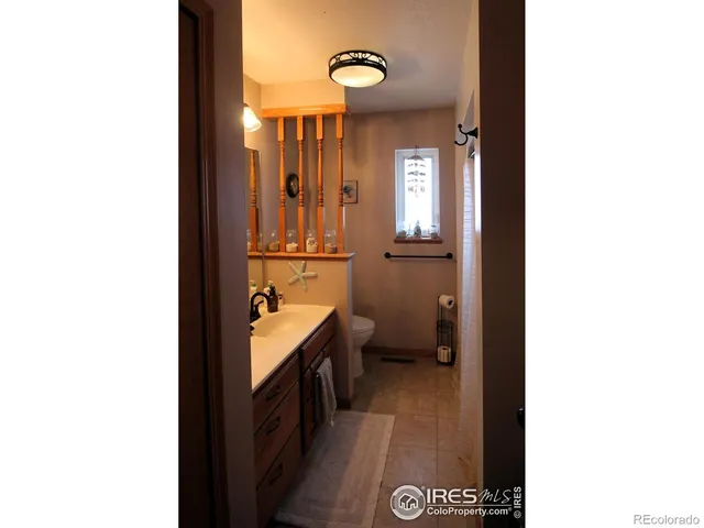 a view of a bathroom from the hallway