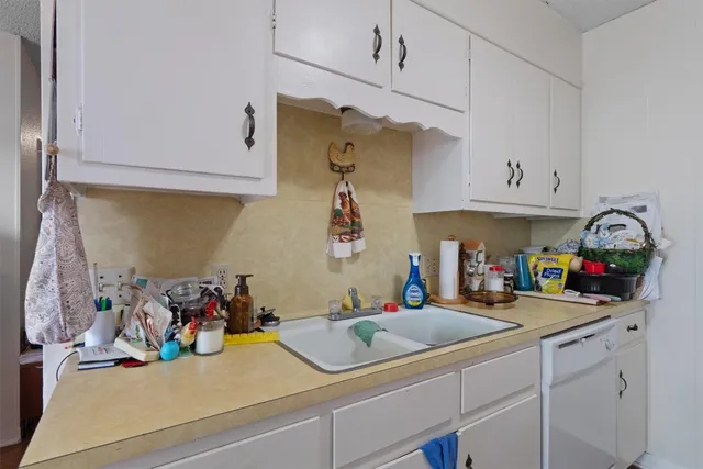 a kitchen with sink cabinets and bike