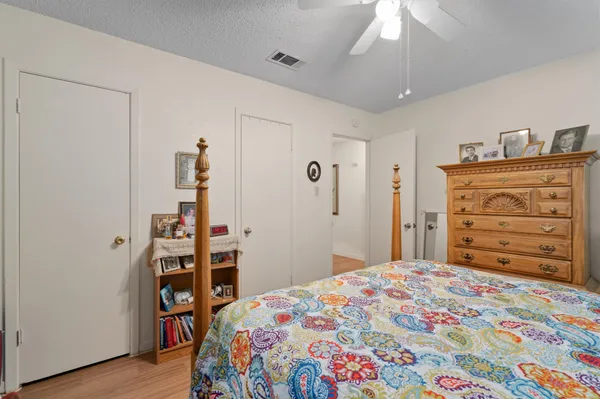 a bedroom with a bed and a dresser