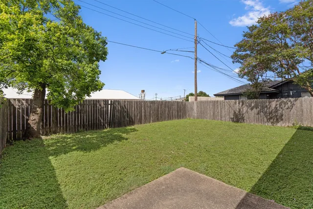 a view of a backyard with green space
