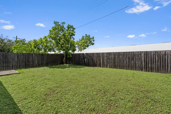 a view of a backyard with green space