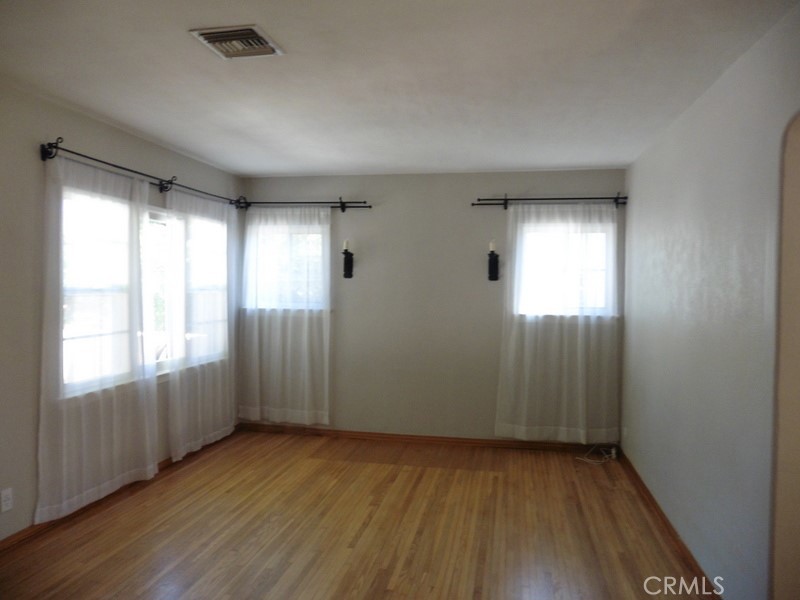 2658 San Marcos Drive Pasadena, CA 91107 - Photo 4 of 19 an empty room with wooden floor and windows