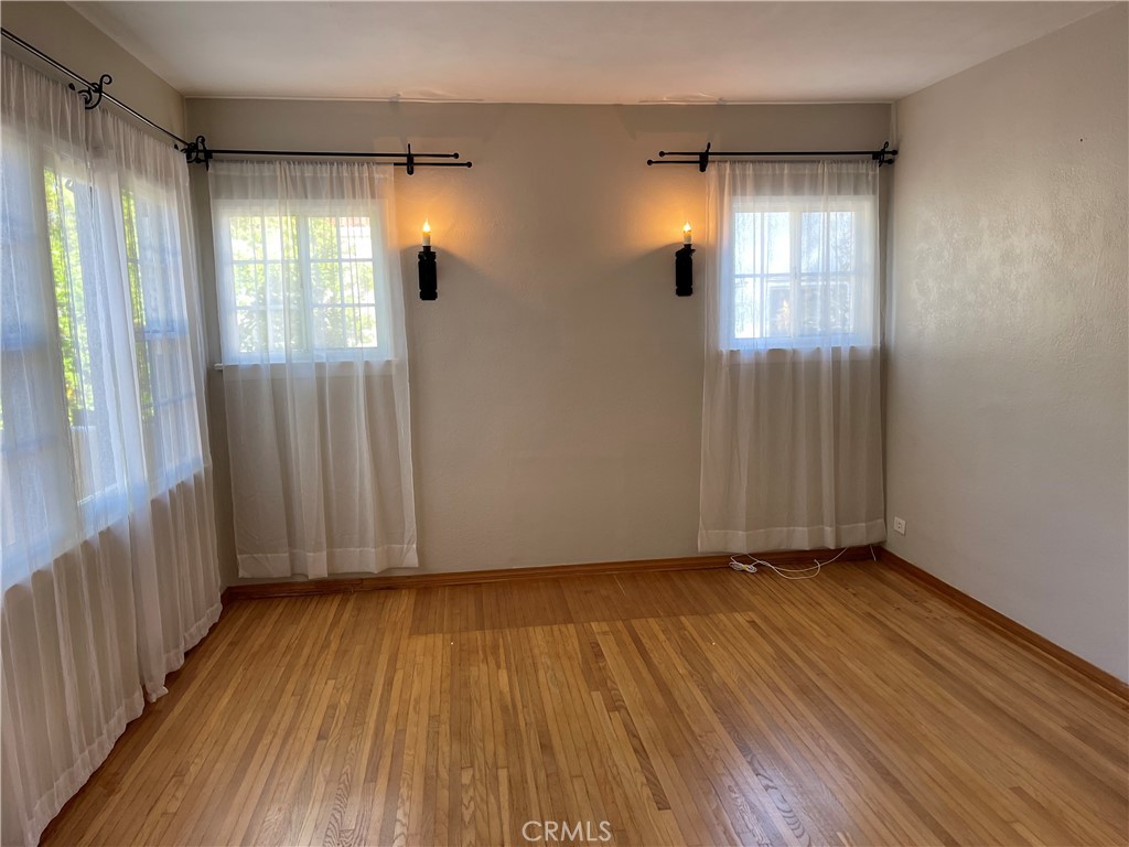 2658 San Marcos Drive Pasadena, CA 91107 - Photo 5 of 19 a view of empty room with wooden floor and fan