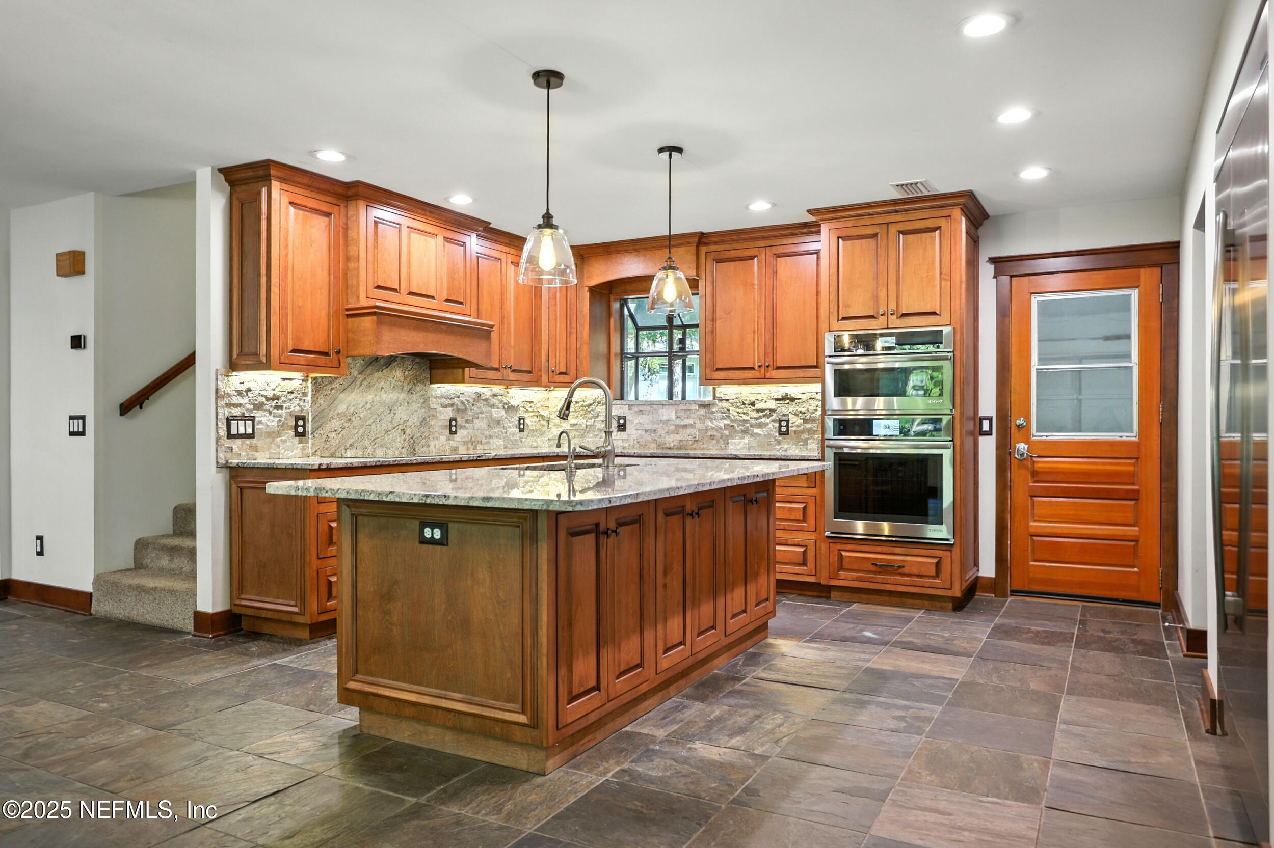 12534 Flynn Road Jacksonville, FL 32223 - Photo 18 of 90 a kitchen with stainless steel appliances granite countertop a stove a sink and a refrigerator