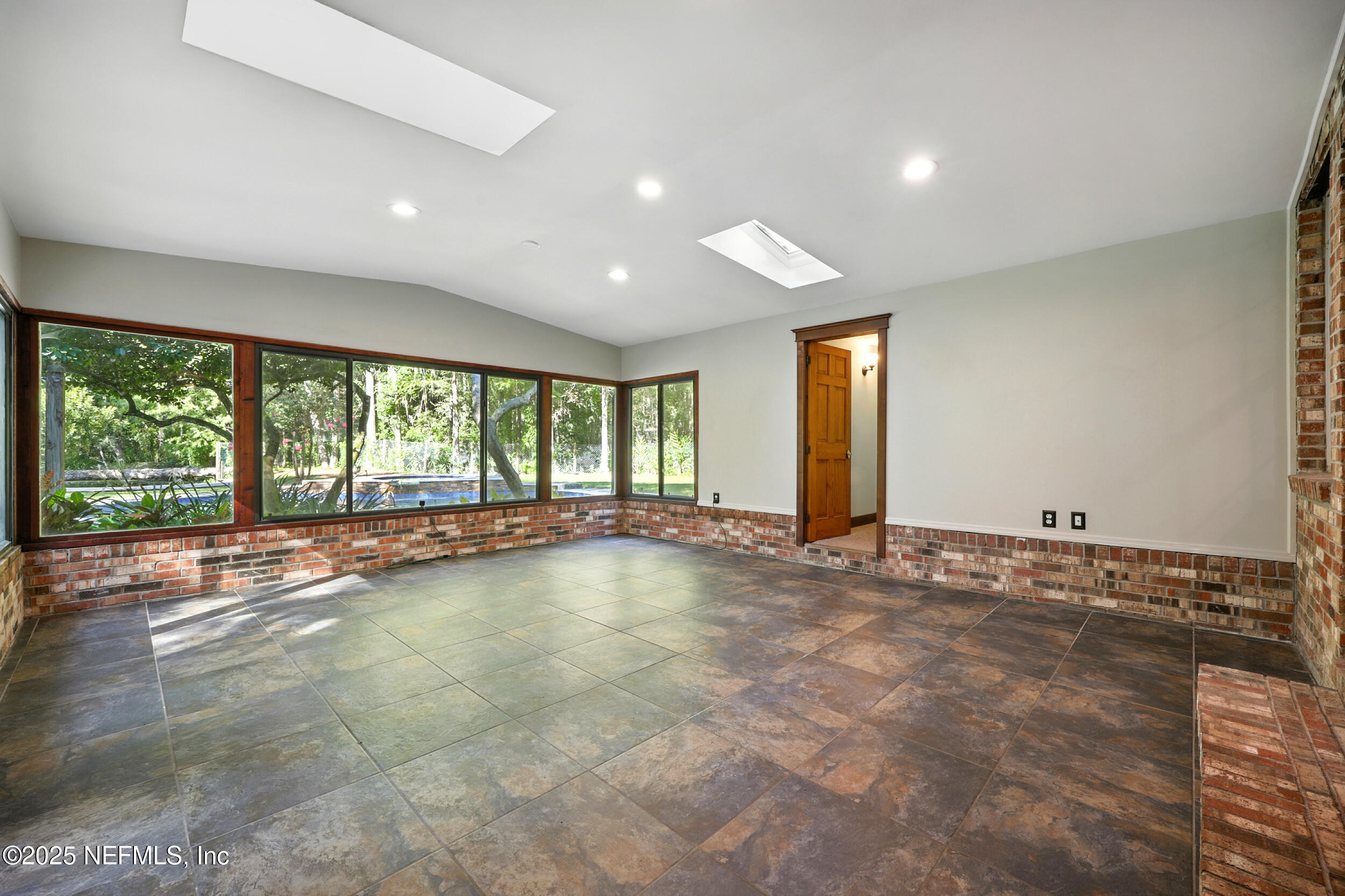 12534 Flynn Road Jacksonville, FL 32223 - Photo 19 of 90 a view of an empty room with a window