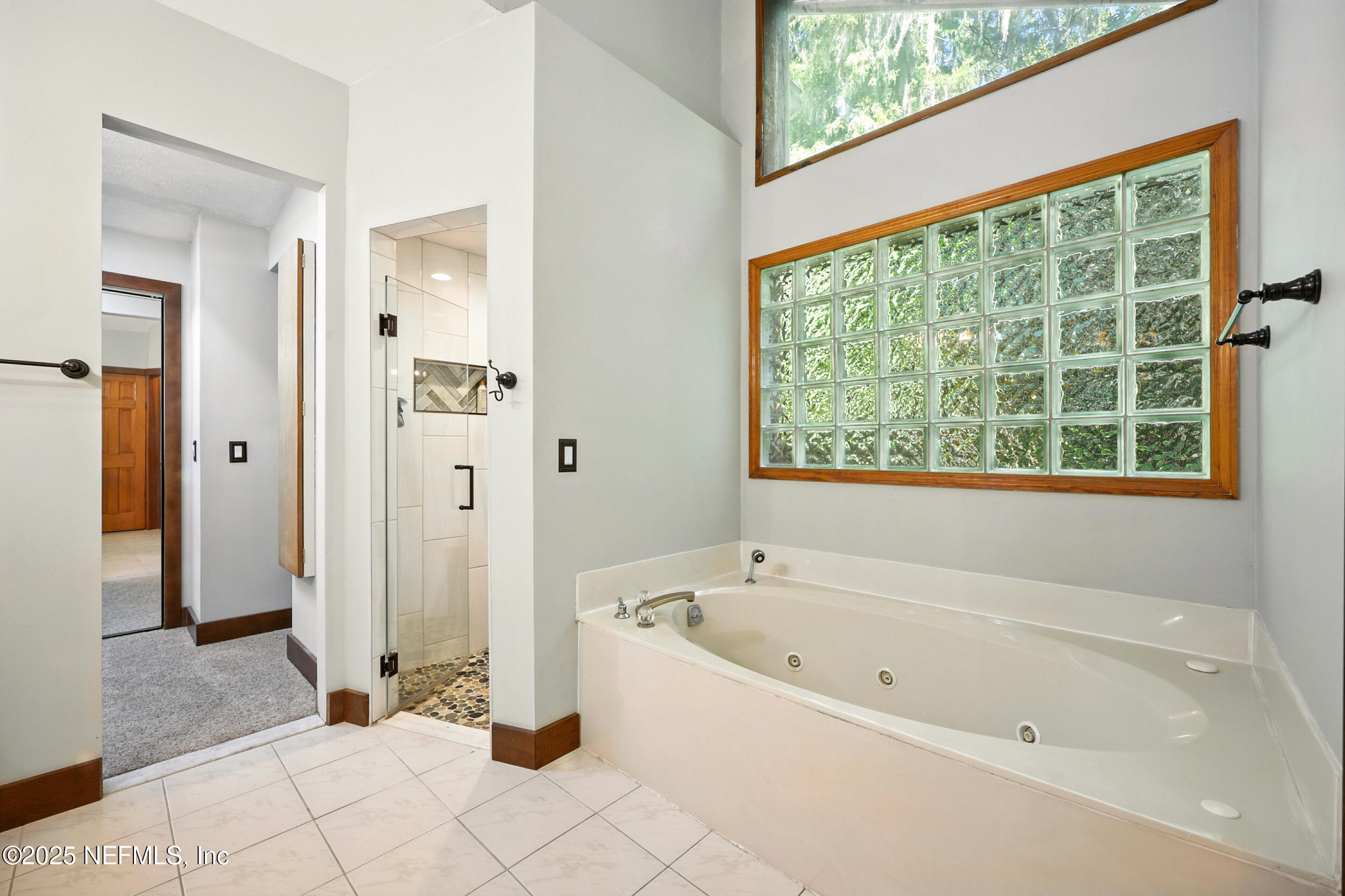 12534 Flynn Road Jacksonville, FL 32223 - Photo 27 of 90 a white bath tub sitting next to a window
