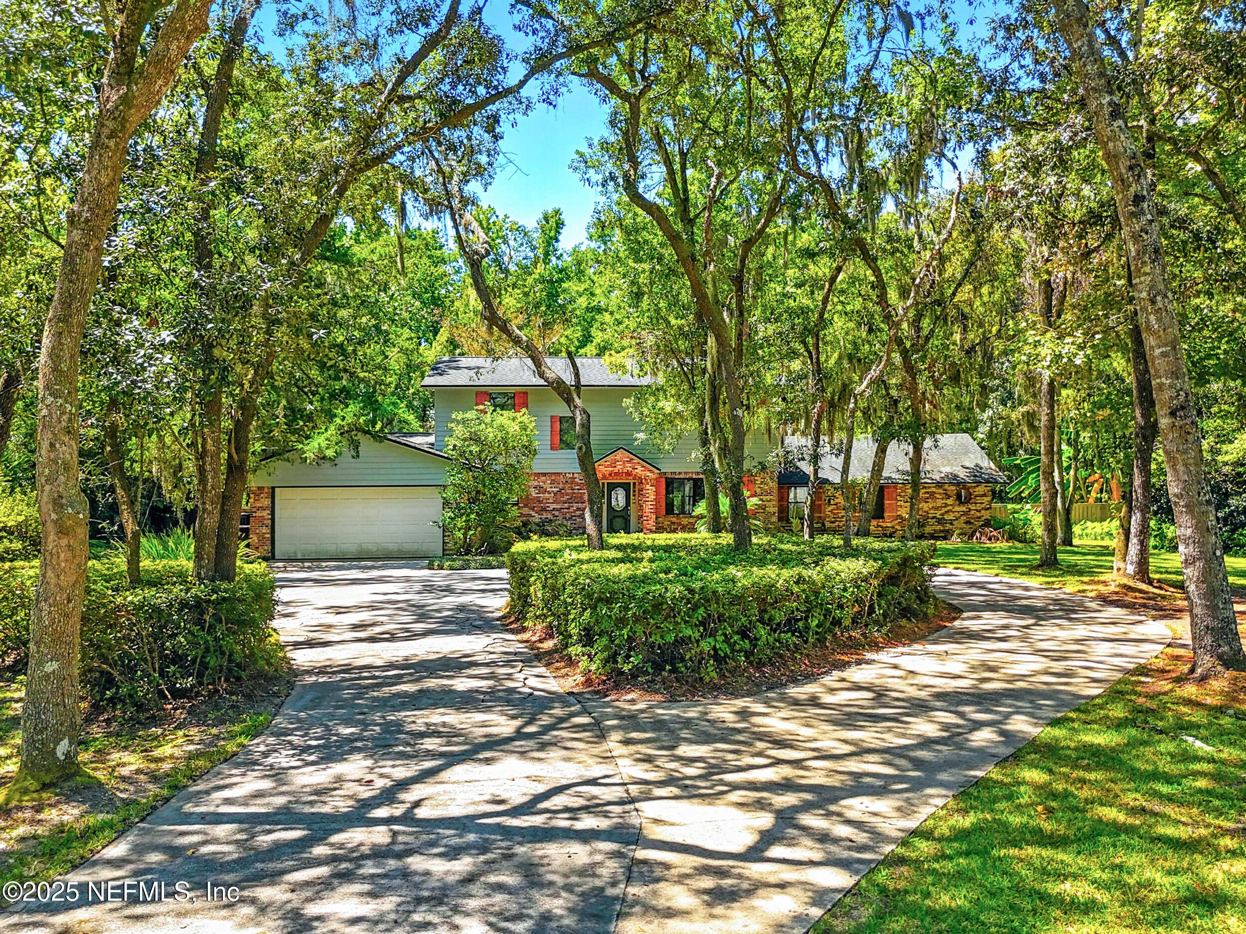 12534 Flynn Road Jacksonville, FL 32223 - Photo 3 of 90 a backyard of a house with outdoor seating and green space