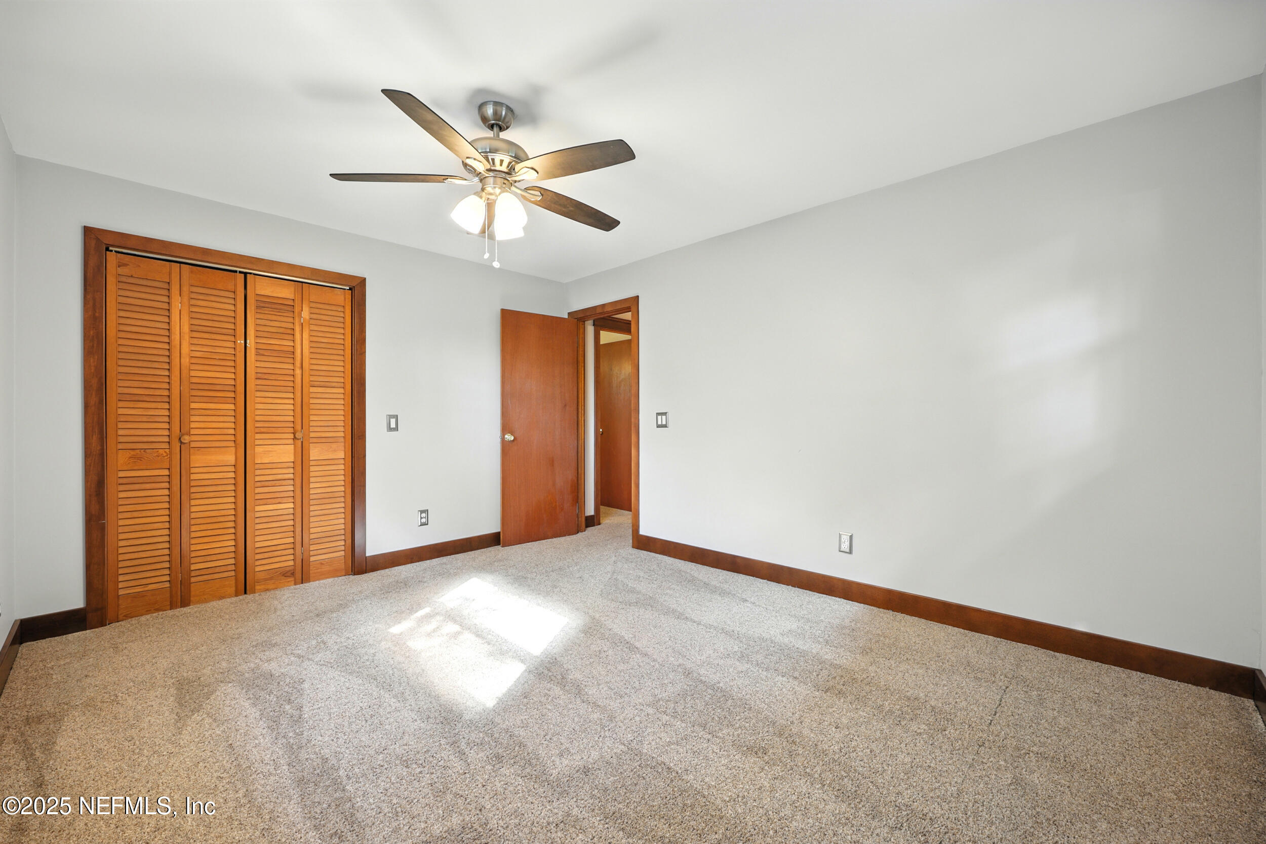 12534 Flynn Road Jacksonville, FL 32223 - Photo 32 of 90 a view of a livingroom with a ceiling fan and window
