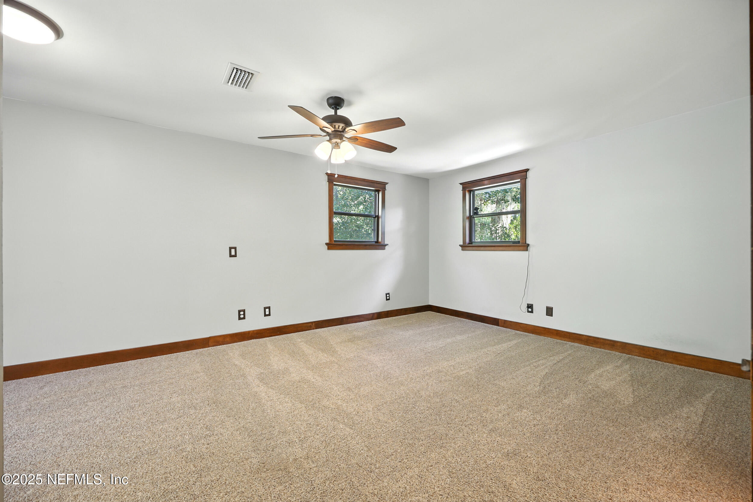 12534 Flynn Road Jacksonville, FL 32223 - Photo 35 of 90 a view of an empty room with a window