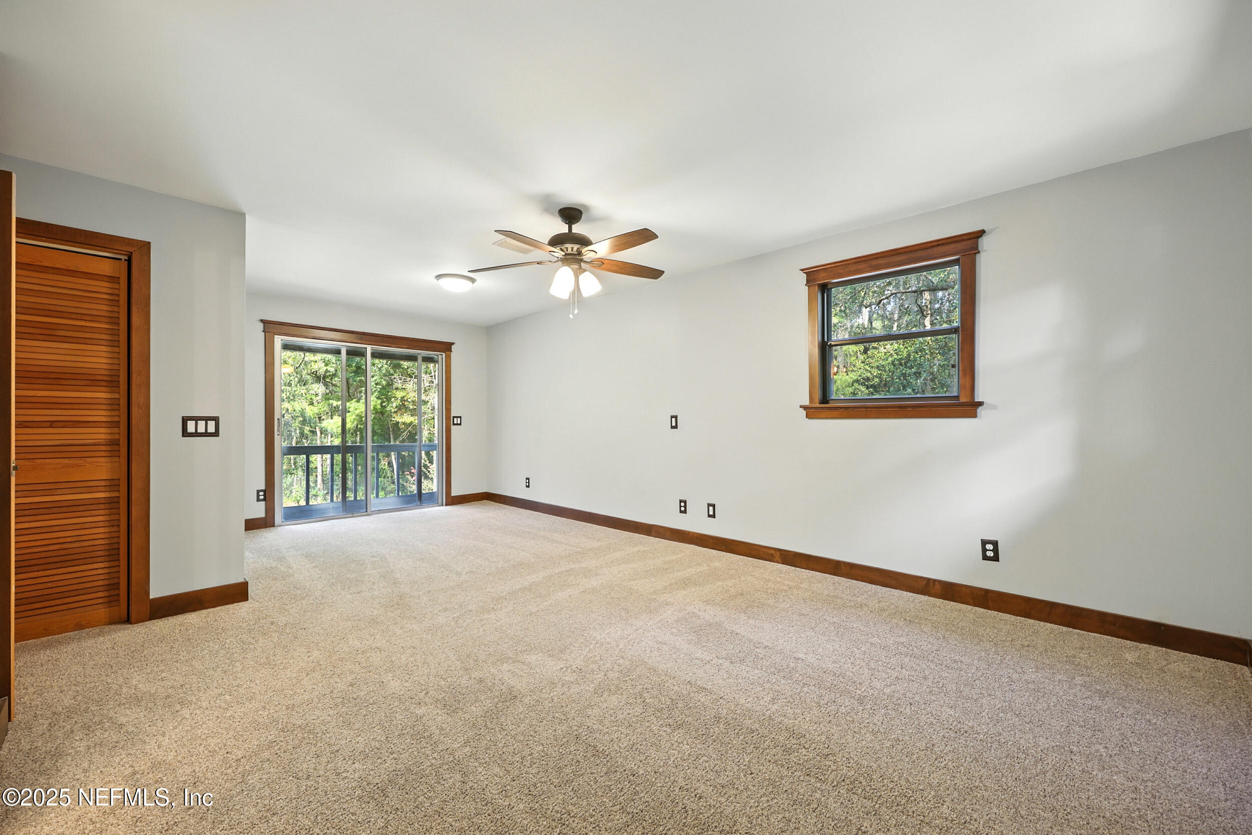 12534 Flynn Road Jacksonville, FL 32223 - Photo 38 of 90 an empty room with windows and fan