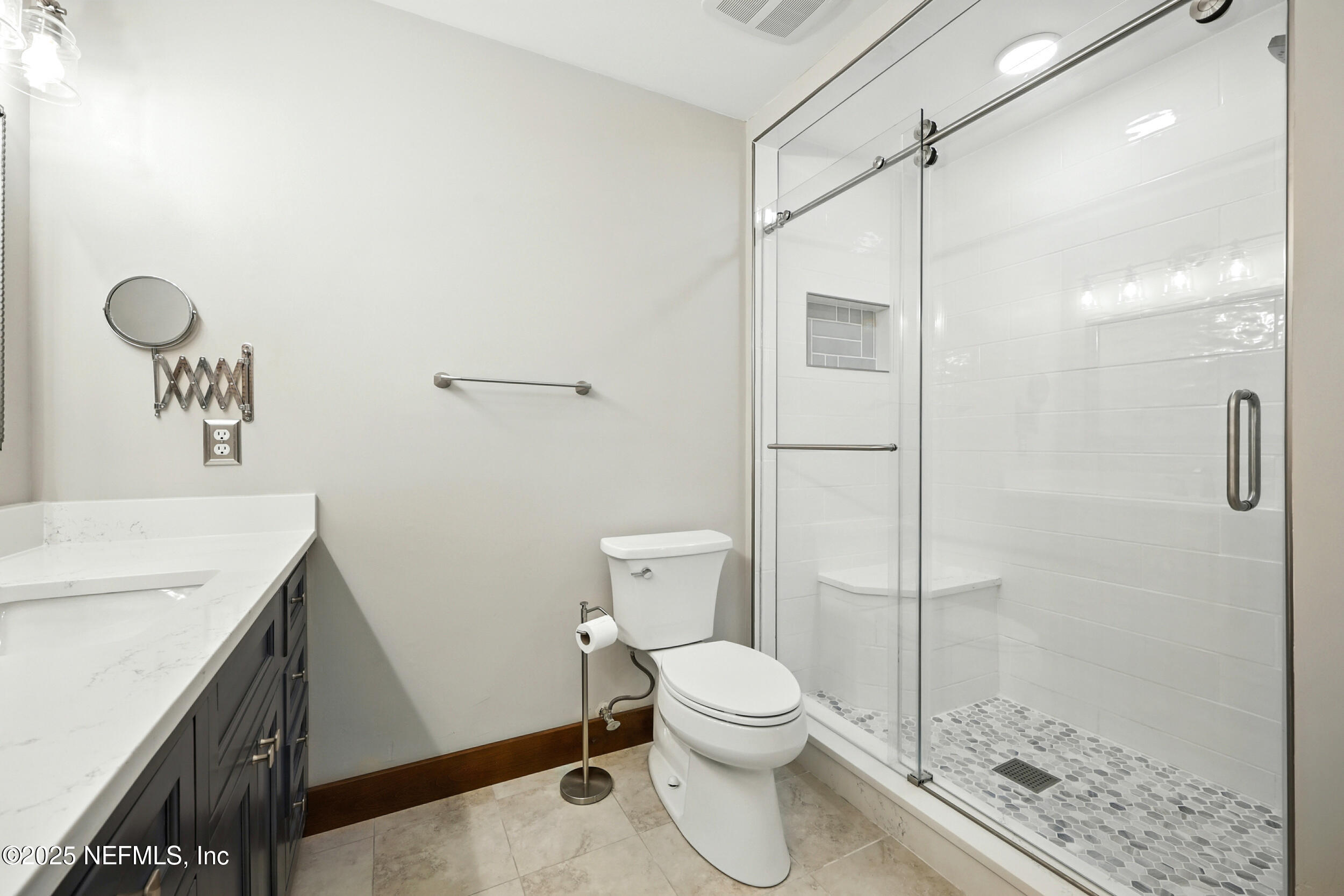 12534 Flynn Road Jacksonville, FL 32223 - Photo 40 of 90 a bathroom with a sink a toilet and shower