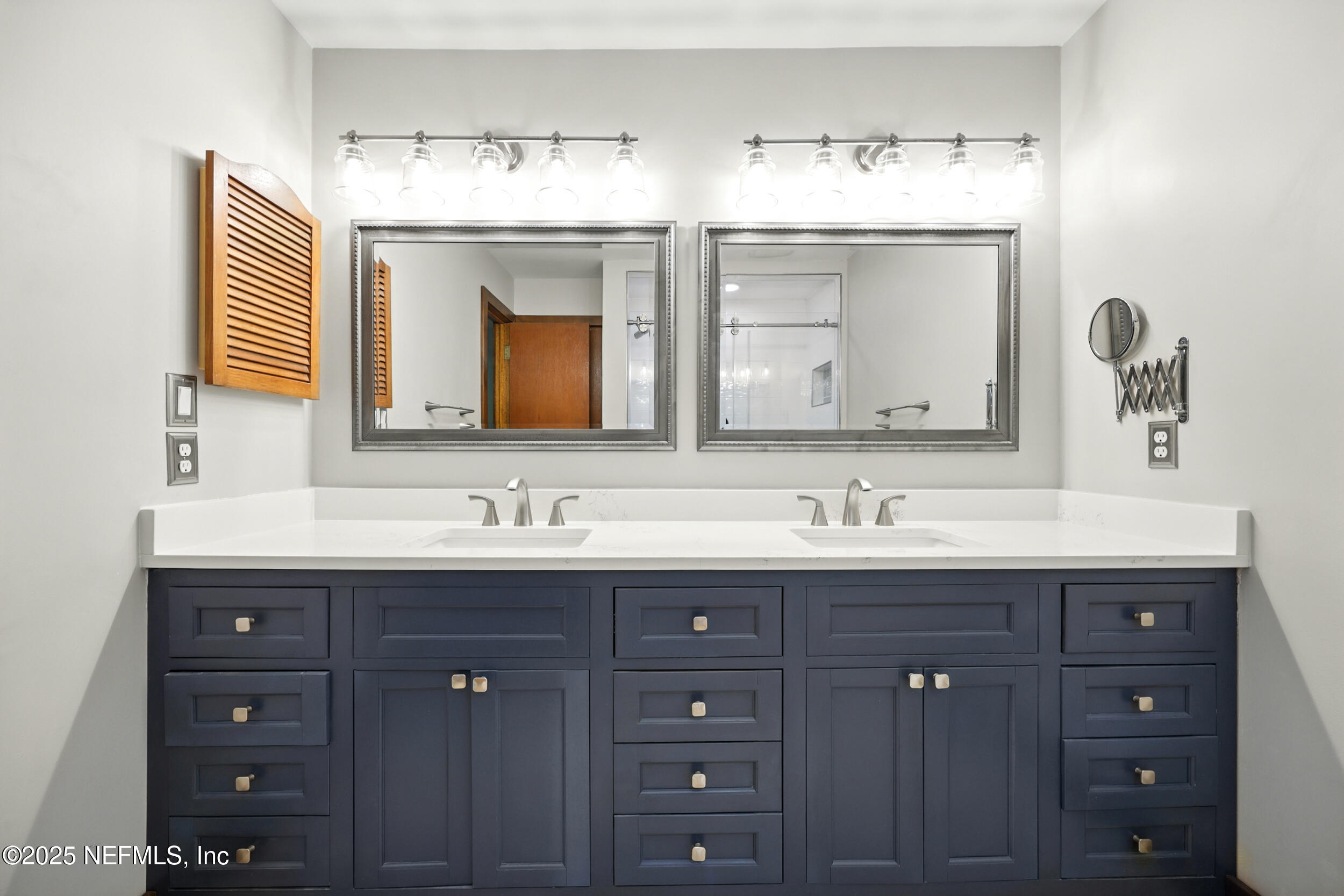 12534 Flynn Road Jacksonville, FL 32223 - Photo 41 of 90 a bathroom with double sink and a mirror