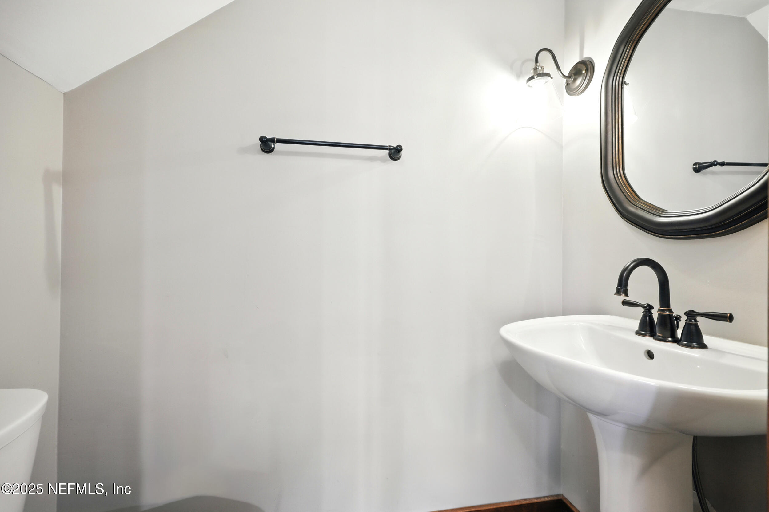 12534 Flynn Road Jacksonville, FL 32223 - Photo 44 of 90 a bathroom with a sink and mirror